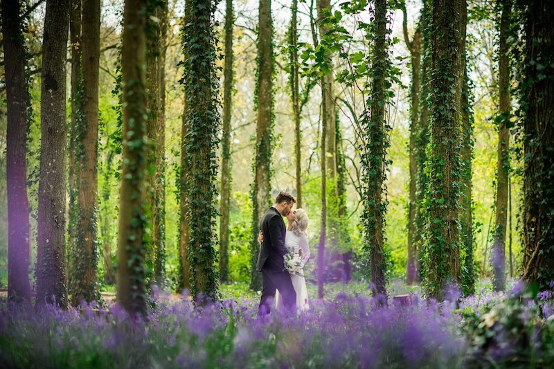 wedding couple in the forest during their luxury package at chateau challain