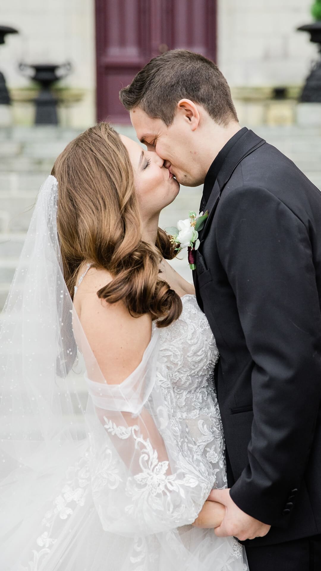 couple of the steps of chateau challain at their luxury wedding share their castle wedding reviews